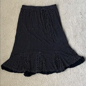 Black skirt with white polka dots.